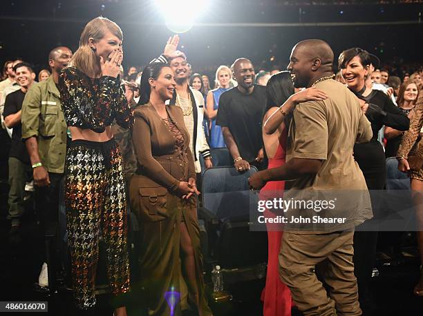 Singer-songwriter Taylor Swift, TV personalities Kim Kardashian, Kourtney Kardashian, rapper Kanye West and TV personality Kris Jenner in the...