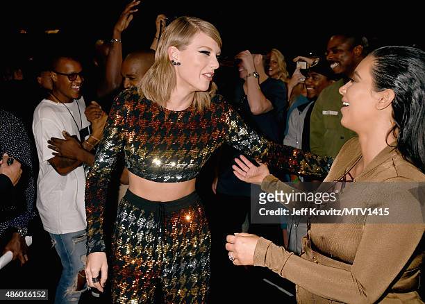 Recording artist Taylor Swift and TV personality Kim Kardashian embrace during the 2015 MTV Video Music Awards at Microsoft Theater on August 30,...