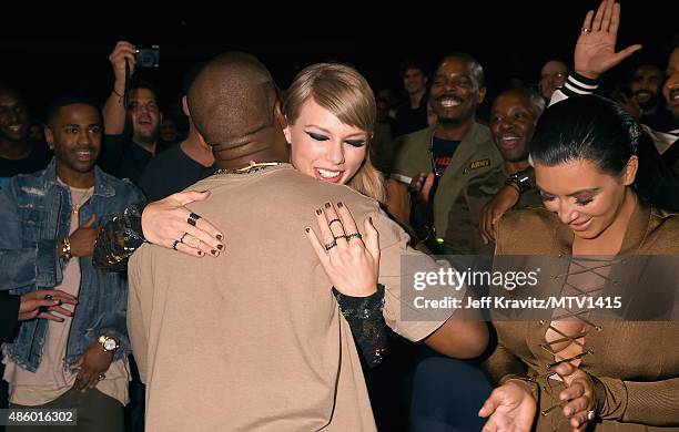 Recording artists Kanye West, Taylor Swift and TV personality Kim Kardashian during the 2015 MTV Video Music Awards at Microsoft Theater on August...