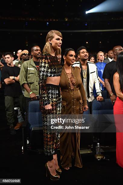 Singer-songwriter Taylor Swift and TV personality Kim Kardashian in the audience during the 2015 MTV Video Music Awards at Microsoft Theater on...