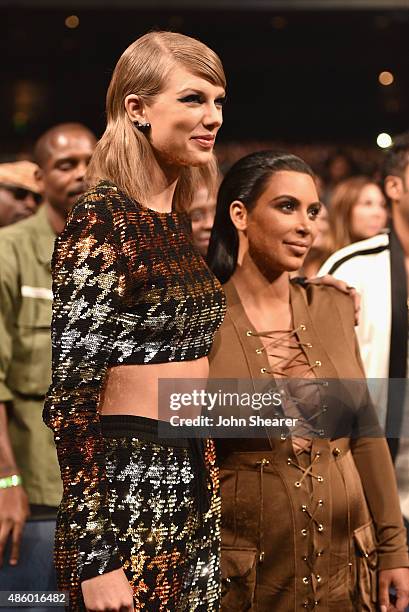 Singer-songwriter Taylor Swift and TV personality Kim Kardashian in the audience during the 2015 MTV Video Music Awards at Microsoft Theater on...