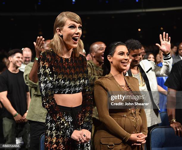 Singer-songwriter Taylor Swift and TV personality Kim Kardashian in the audience during the 2015 MTV Video Music Awards at Microsoft Theater on...