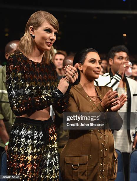 Singer-songwriter Taylor Swift and TV personality Kim Kardashian in the audience during the 2015 MTV Video Music Awards at Microsoft Theater on...