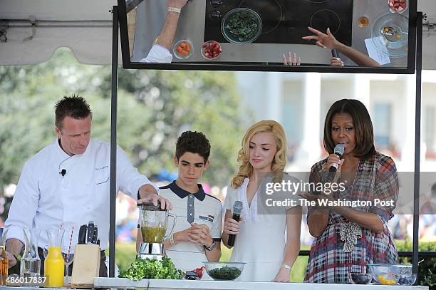 Chef, Marc Murphy, left to right, Cameron Boyce and Peyton List of the television show, "Jessie" join First Lady Michelle Obama on stage for a food...