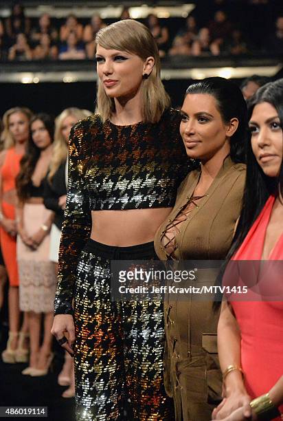 Recording artist Taylor Swift, TV personalities Kim Kardashian and Kourtney Kardashian during the 2015 MTV Video Music Awards at Microsoft Theater on...