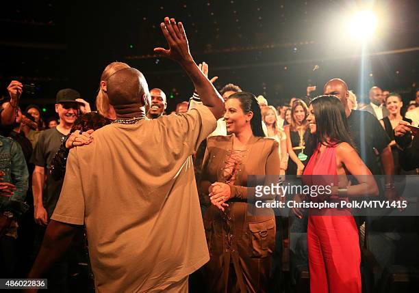Recording artists Kanye West, Taylor Swift, and TV personality Kim Kardashian attend the 2015 MTV Video Music Awards at Microsoft Theater on August...