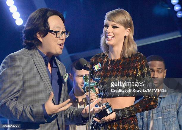 Recording artist Taylor Swift and director Joseph Kahn accept the Video of the Year award for "Bad Blood" onstage during the 2015 MTV Video Music...