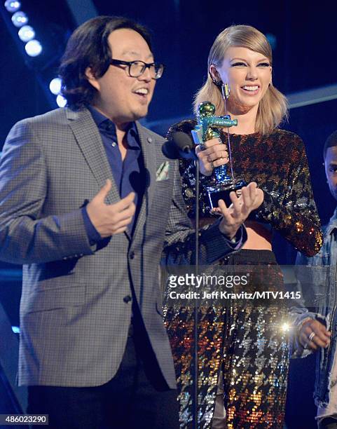 Recording artist Taylor Swift and director Joseph Kahn accept the Video of the Year award for "Bad Blood" onstage during the 2015 MTV Video Music...