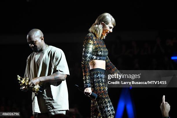 Recording artist Kanye West accepts the Vanguard Award from recording artist Taylor Swift onstage during the 2015 MTV Video Music Awards at Microsoft...