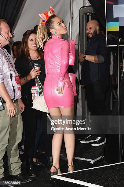 Host Miley Cyrus, styled by Simone Harouche, poses in the press room at the 2015 MTV Video Music Awards at Microsoft Theater on August 30, 2015 in...