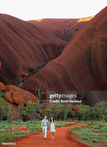 Catherine, Duchess of Cambridge and Prince William, Duke of Cambridge walk down Kuniya Walk at the base of Uluru on April 22, 2014 in Ayers Rock,...