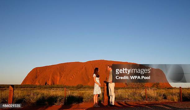 Catherine, Duchess of Cambridge and Prince William, Duke of Cambridge pose in front of Uluru, also known as Ayers Rock, on April 22, 2014 in Ayers...