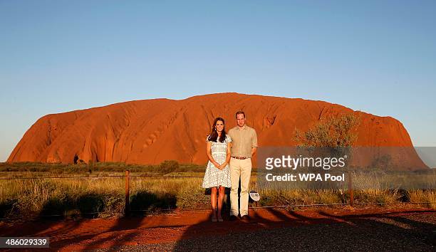 Catherine, Duchess of Cambridge and Prince William, Duke of Cambridge pose in front of Uluru, also known as Ayers Rock, on April 22, 2014 in Ayers...