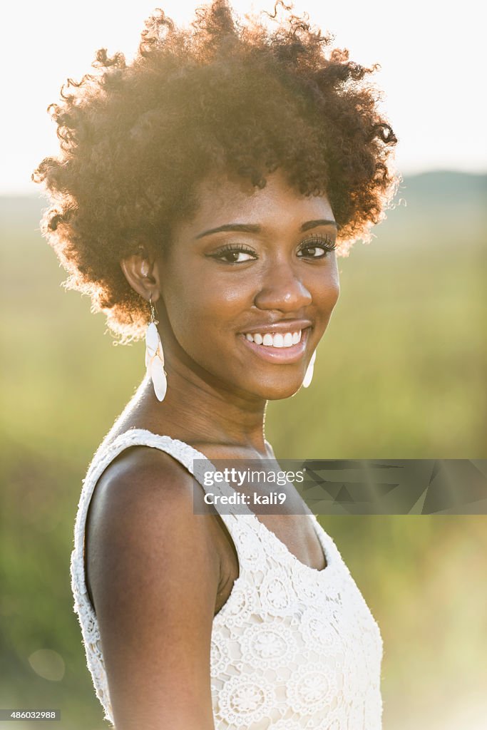 Face of a young black woman in bright sunlight