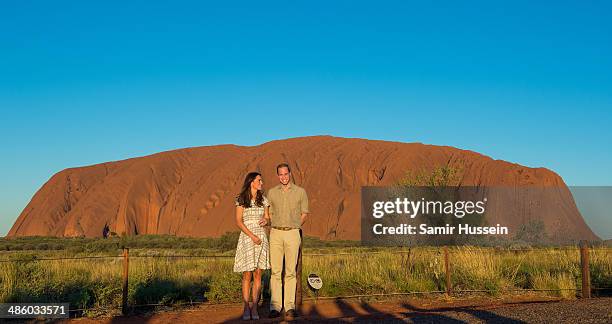 Prince William, Duke of Cambridge and Catherine, Duchess of Cambridge view Ayers Rock at sunset on April 22, 2014 in Ayers Rock, Australia. The Duke...