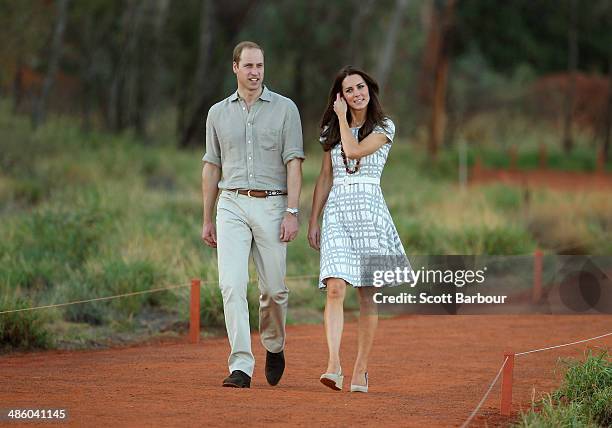 Catherine, Duchess of Cambridge and Prince William, Duke of Cambridge walk down Kuniya Walk at the base of Uluru on April 22, 2014 in Ayers Rock,...