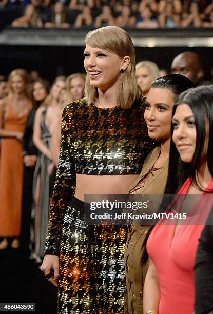 Recording artist Taylor Swift, TV personalities Kim Kardashian and Kourtney Kardashian during the 2015 MTV Video Music Awards at Microsoft Theater on...