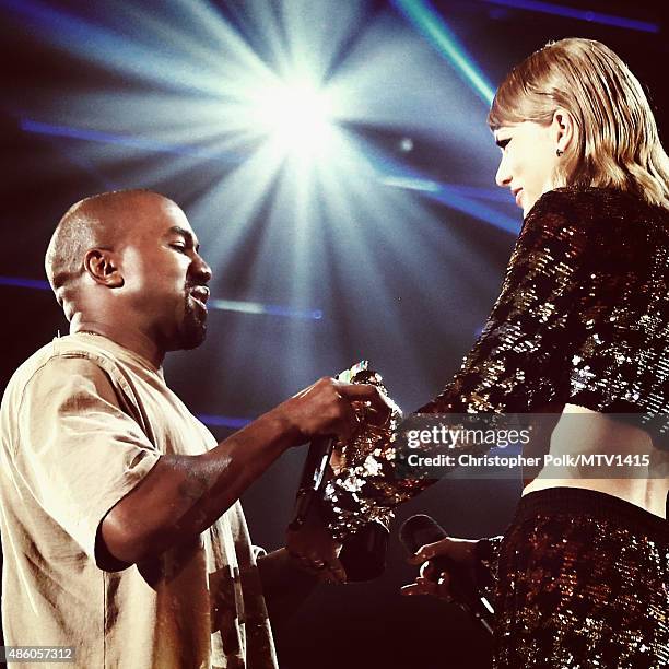 Recording artist Kanye West accepts the Vanguard Award from recording artist Taylor Swift onstage during the 2015 MTV Video Music Awards at Microsoft...