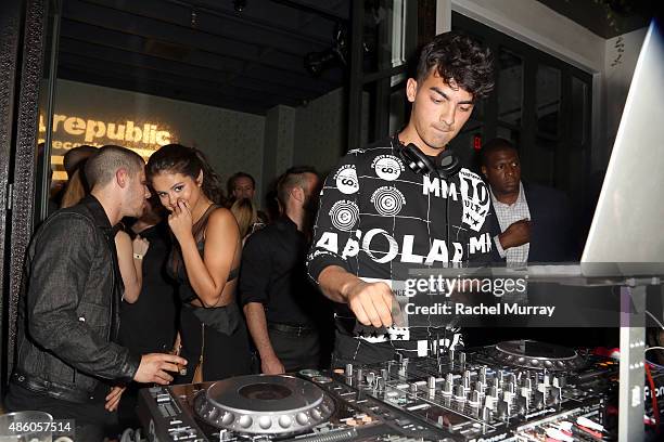 Nick Jonas, Selena Gomez and Joe Jonas attend Republic Records 2015 VMA after party at Ysabel on August 30, 2015 in West Hollywood, California.