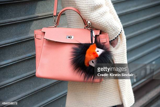 Photographer Micol Sabbadini wears a vintage Chanel jacket, Hermes bag, Fendi Monster Pom Pom on day 5 of Paris Collections: Women on March 01, 2014...