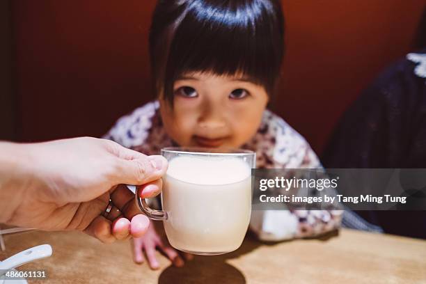little girl having soy milk in restaurant - soya milk stock pictures, royalty-free photos & images