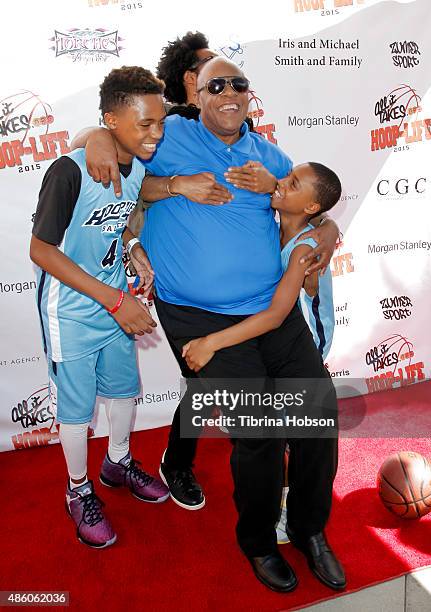 Kailand Morris, Kwame Morris and Mandla Morris lift their father, Stevie Wonder , on the red carpet at the 3rd annual Hoop-Life FriendRaiser at Galen...