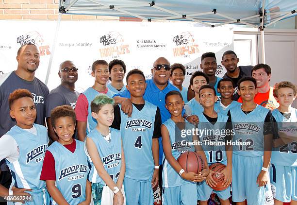 Stevie Wonder poses with his sons basketball team at the 3rd annual Hoop-Life FriendRaiser at Galen Center on August 30, 2015 in Los Angeles,...