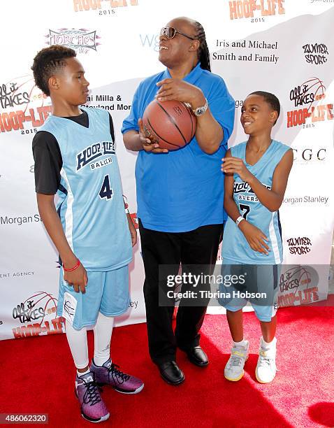 Stevie Wonder plays around with his sons Kailand Morris and Mandla Morris at the 3rd annual Hoop-Life FriendRaiser at Galen Center on August 30, 2015...