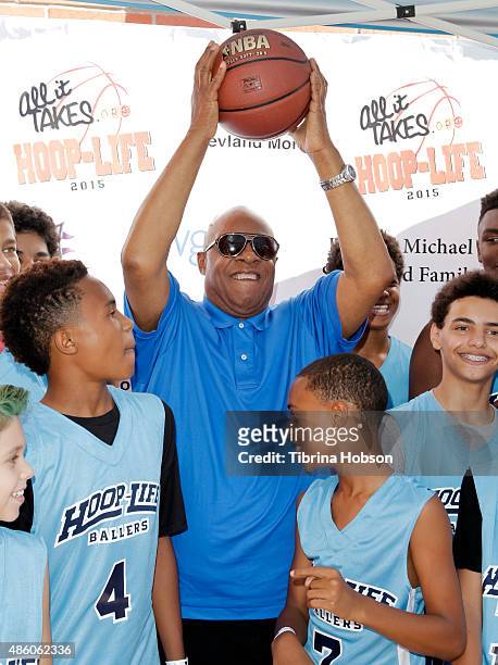 Stevie Wonder plays around with his sons Kailand Morris and Mandla Morris at the 3rd annual Hoop-Life FriendRaiser at Galen Center on August 30, 2015...