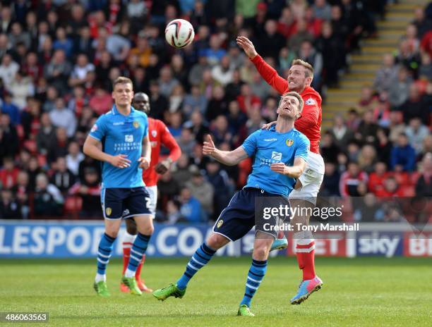 Liam Lawrence of Barnsley tackles Michael Tonge of Leeds United during the Sky Bet Championship match between Barnsley and Leeds United at Oakwell on...