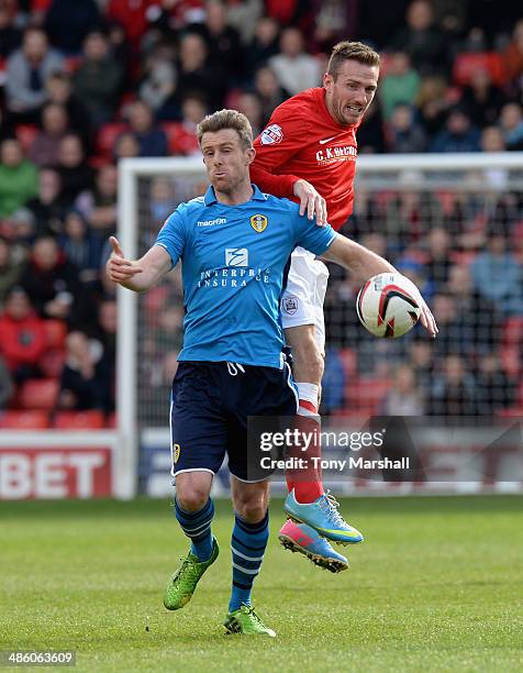 Liam Lawrence of Barnsley tackles Michael Tonge of Leeds United during the Sky Bet Championship match between Barnsley and Leeds United at Oakwell on...