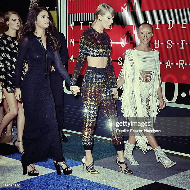 Actress Selena Gomez, singer Taylor Swift and actress Serayah arrive at the 2015 MTV Video Music Awards at Microsoft Theater on August 30, 2015 in...