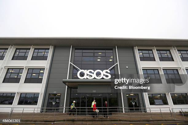 Visitors pass the main entrance to Asos Plc's distribution warehouse in Barnsley, U.K., on Tuesday, April 22, 2014. Asos, the U.K.'s largest...