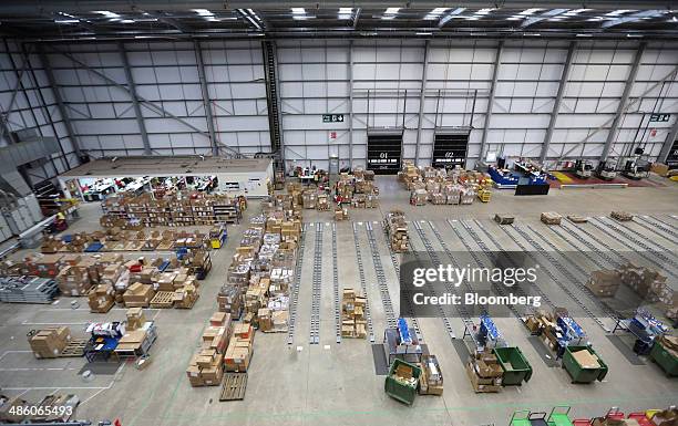 Pallets laden with boxes sit in the 'Goods Inward' section of Asos Plc's distribution warehouse in Barnsley, U.K., on Tuesday, April 22, 2014. Asos,...