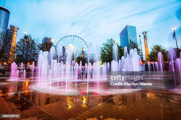 colorful centennial fountain at night - centenial olympic park stock pictures, royalty-free photos & images