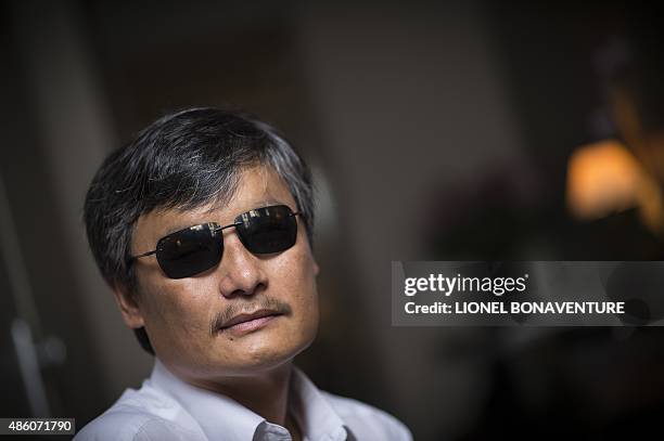 Chinese popular human rights activist Chen Guangcheng poses in Paris on August 31, 2015. Chen, who enraged authorities by exposing forced abortions...