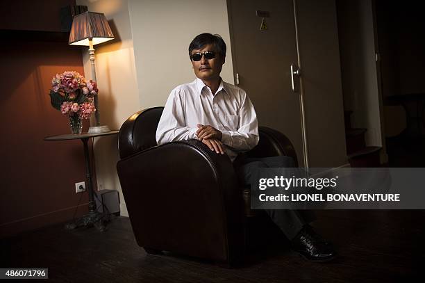 Chinese popular human rights activist Chen Guangcheng poses in Paris on August 31, 2015. Chen, who enraged authorities by exposing forced abortions...