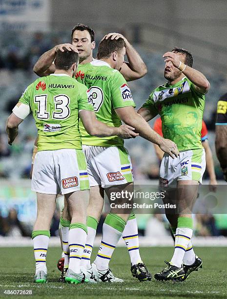 Raiders players celebrate during the round 25 NRL match between the Canberra Raiders and the Penrith Panthers at GIO Stadium on August 31, 2015 in...