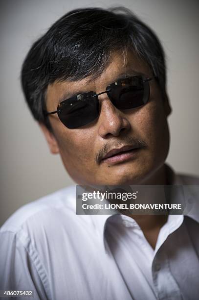 Chinese popular human rights activist Chen Guangcheng poses in Paris on August 31, 2015. Chen, who enraged authorities by exposing forced abortions...