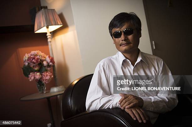 Chinese popular human rights activist Chen Guangcheng poses in Paris on August 31, 2015. Chen, who enraged authorities by exposing forced abortions...