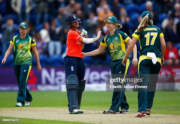 Lydia Greenway of England shakes hands with the Australian team after their match win during the 3rd NatWest T20 of the Women's Ashes Series between...