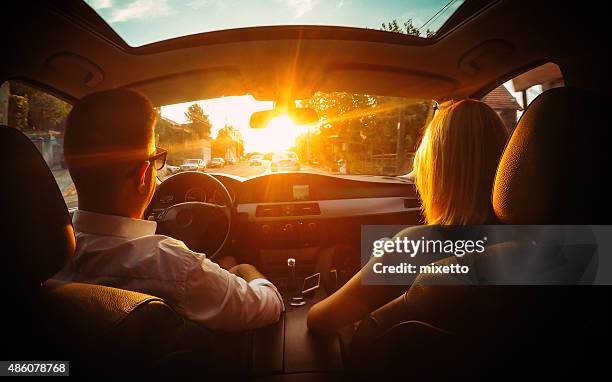 in  car - driving sun stockfoto's en -beelden