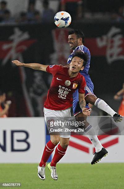 Antonio Monteiro Dutra of Yokohama F. Marinos competes for the ball with Rong Hao of Guangzhou Evergrande during the AFC Asian Champions League match...
