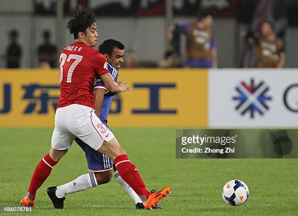 Antonio Monteiro Dutra of Yokohama F. Marinos competes for the ball with Zhao Xuri of Guangzhou Evergrande during the AFC Asian Champions League...