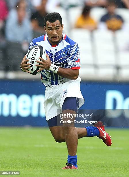 Vavao Afemai of Samoa runs with the ball during the Rugby Union match between the Barbarians and Samoa at the Olympic Stadium on August 29, 2015 in...