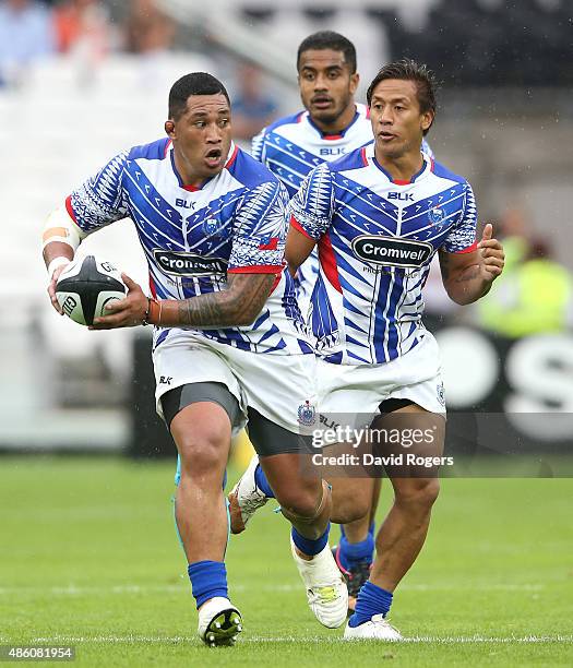 Anthony Perenise of Samoa runs with the ball during the Rugby Union match between the Barbarians and Samoa at the Olympic Stadium on August 29, 2015...