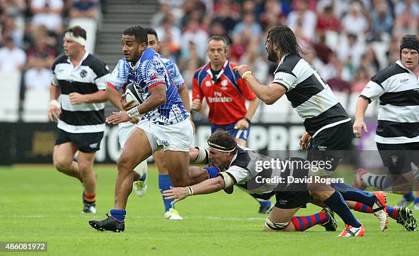 Reynold Lee-Lo of Samoa runs with the ball during the Rugby Union match between the Barbarians and Samoa at the Olympic Stadium on August 29, 2015 in...