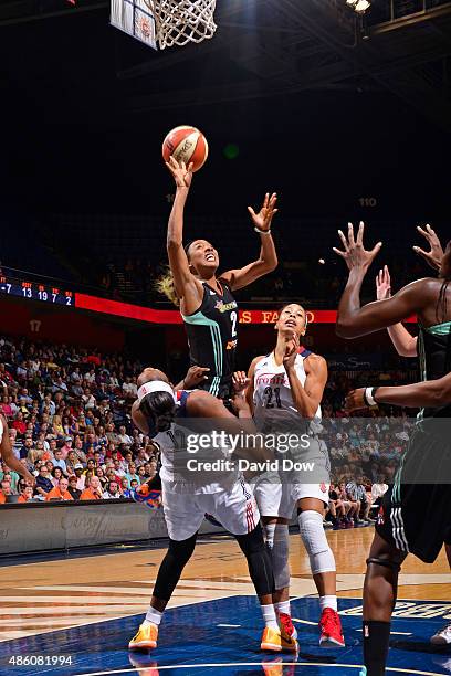 Candice Wiggins of the New York Liberty drives to the basket against the Connecticut Sun on August 29, 2015 at the Mohegan Sun Arena in Uncasville,...