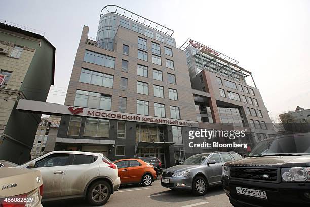 Automobiles from foreign manufacturers pass the offices of the Credit Bank of Moscow in Moscow, Russia, on Tuesday, April 22, 2014. Bankers collected...