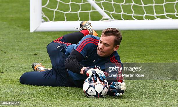 Goalkeeper Manuel Neuer makes a save during their FC Bayern Muenchen training at the Santiago Bernabeu Stadium ahead of the UEFA Champions League...